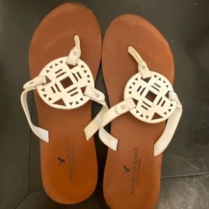 Medallion flip flops